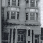 black-and-white-picture-of-front-of-an-early-PLL-home